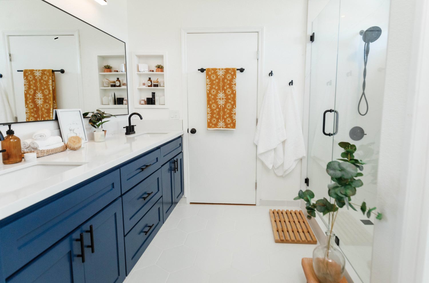 white bathroom with blue vanity
